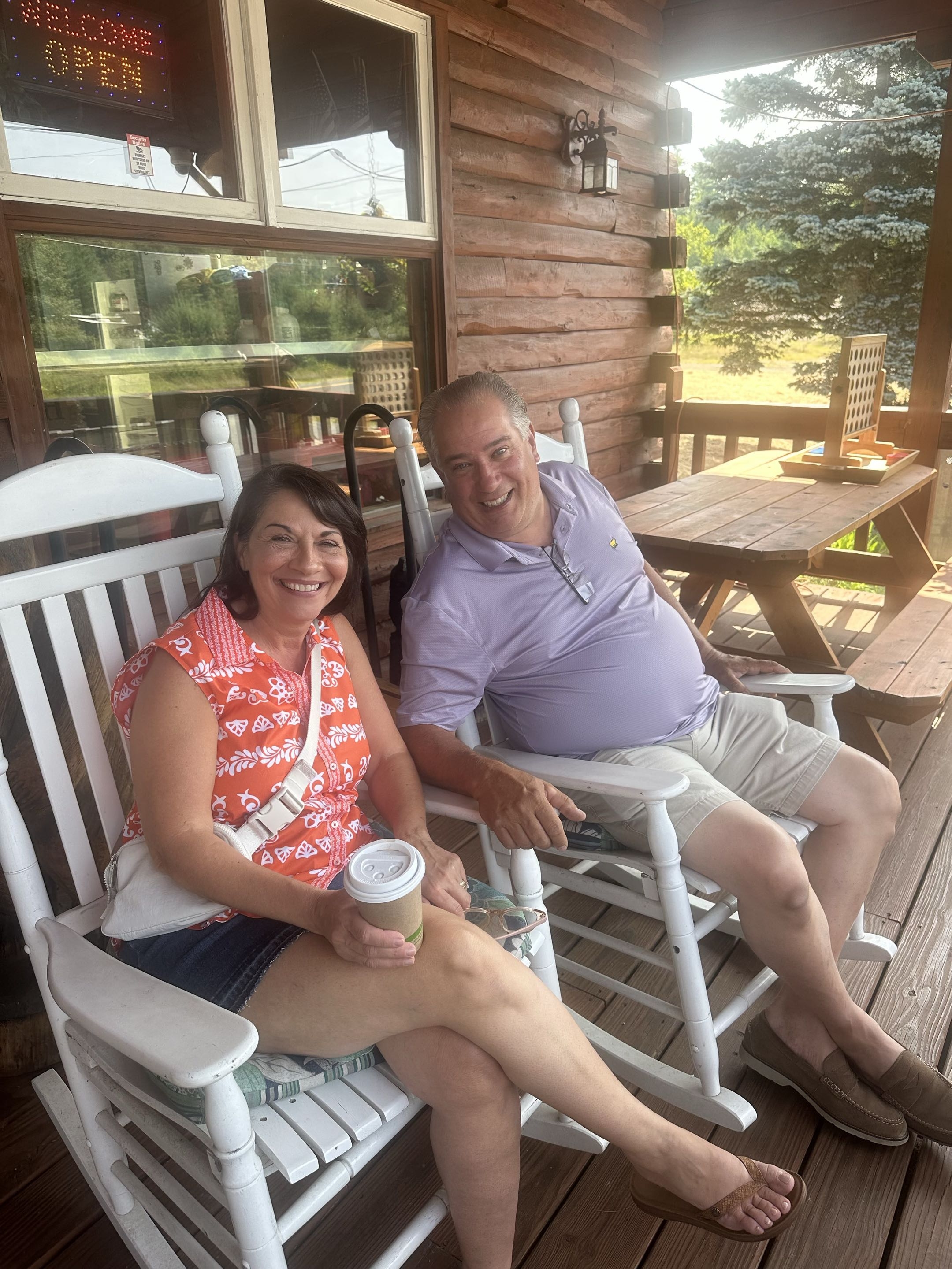 Couple relaxing on the porch in rocking chairs